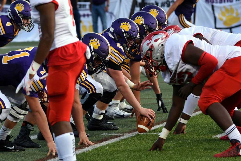 football players in red and white jersey shirt