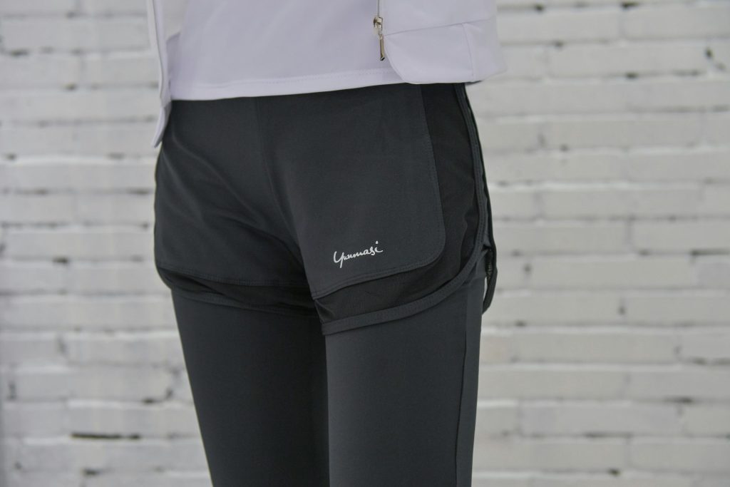 person in black adidas pants